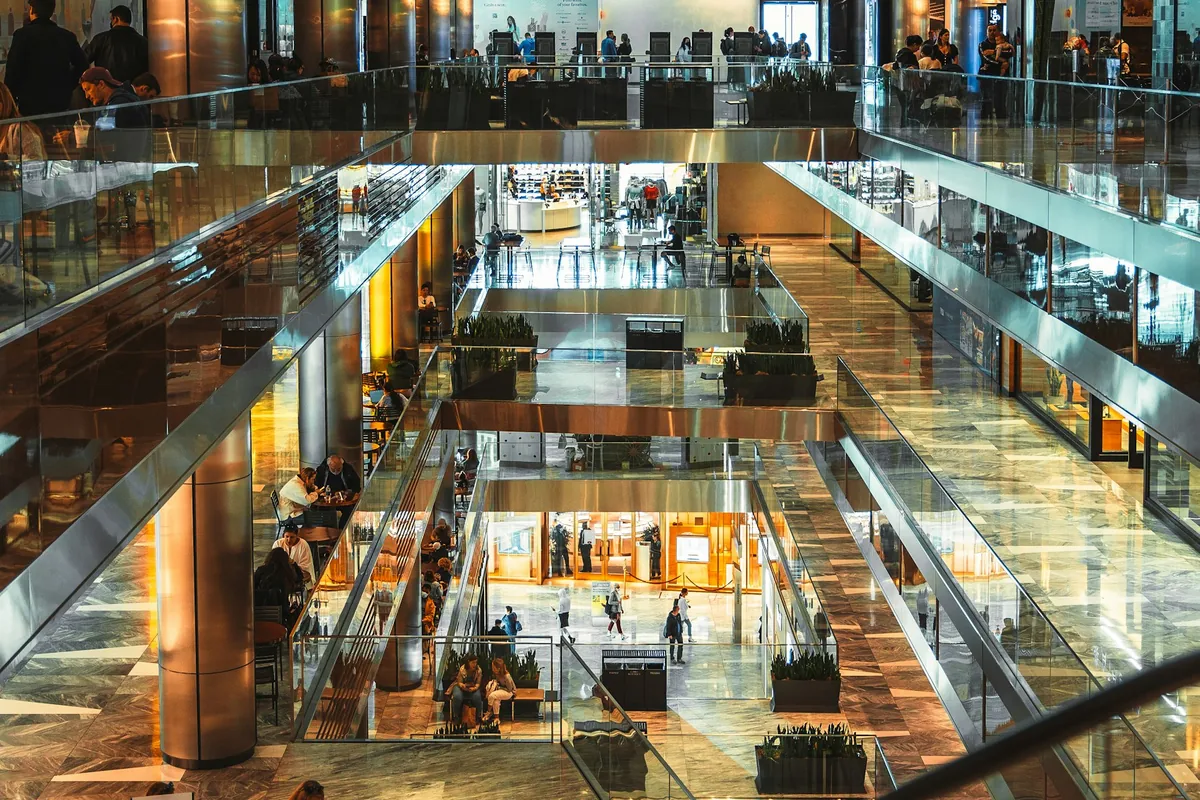 Illustrative stock photograph of a modern shopping mall with several retail levels.