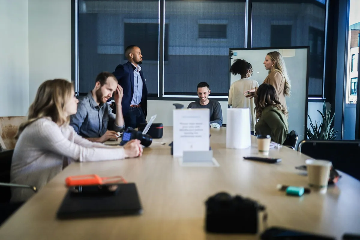 Business team reviewing project work together in an office