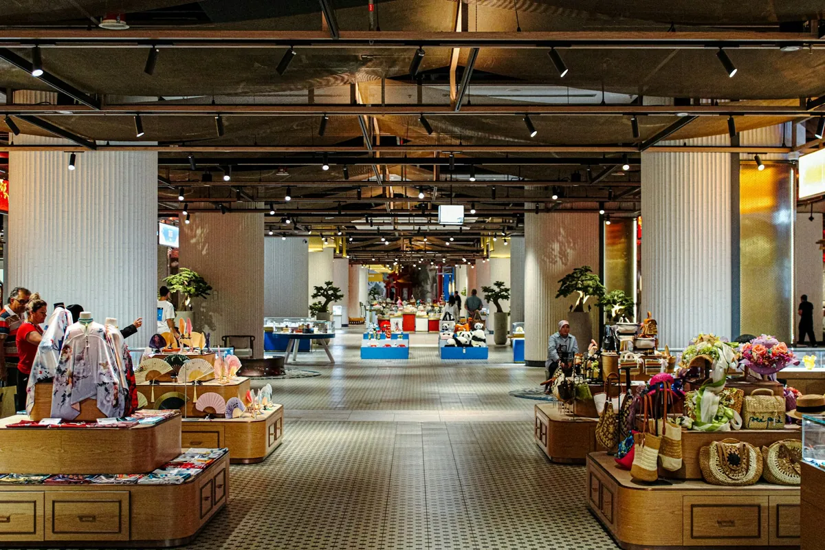 Modern retail interior with clothing, bags and merchandise displays